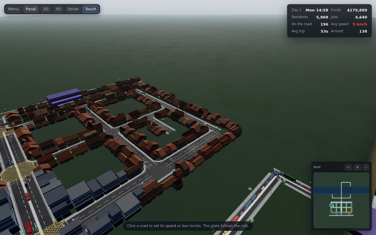 Daytime 3D view over a town, with a queue of cars backed up along the bridge approach.