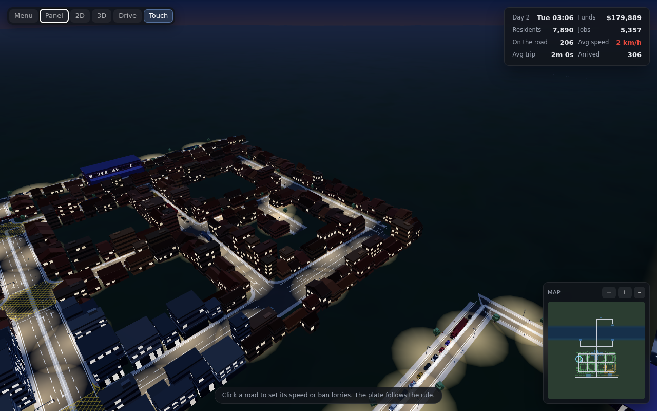 A city at night in the 3D view, street lights along every road, traffic queueing across a bridge.